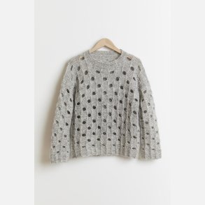 Sweater i sekvenser med forskudte ostehuller 1